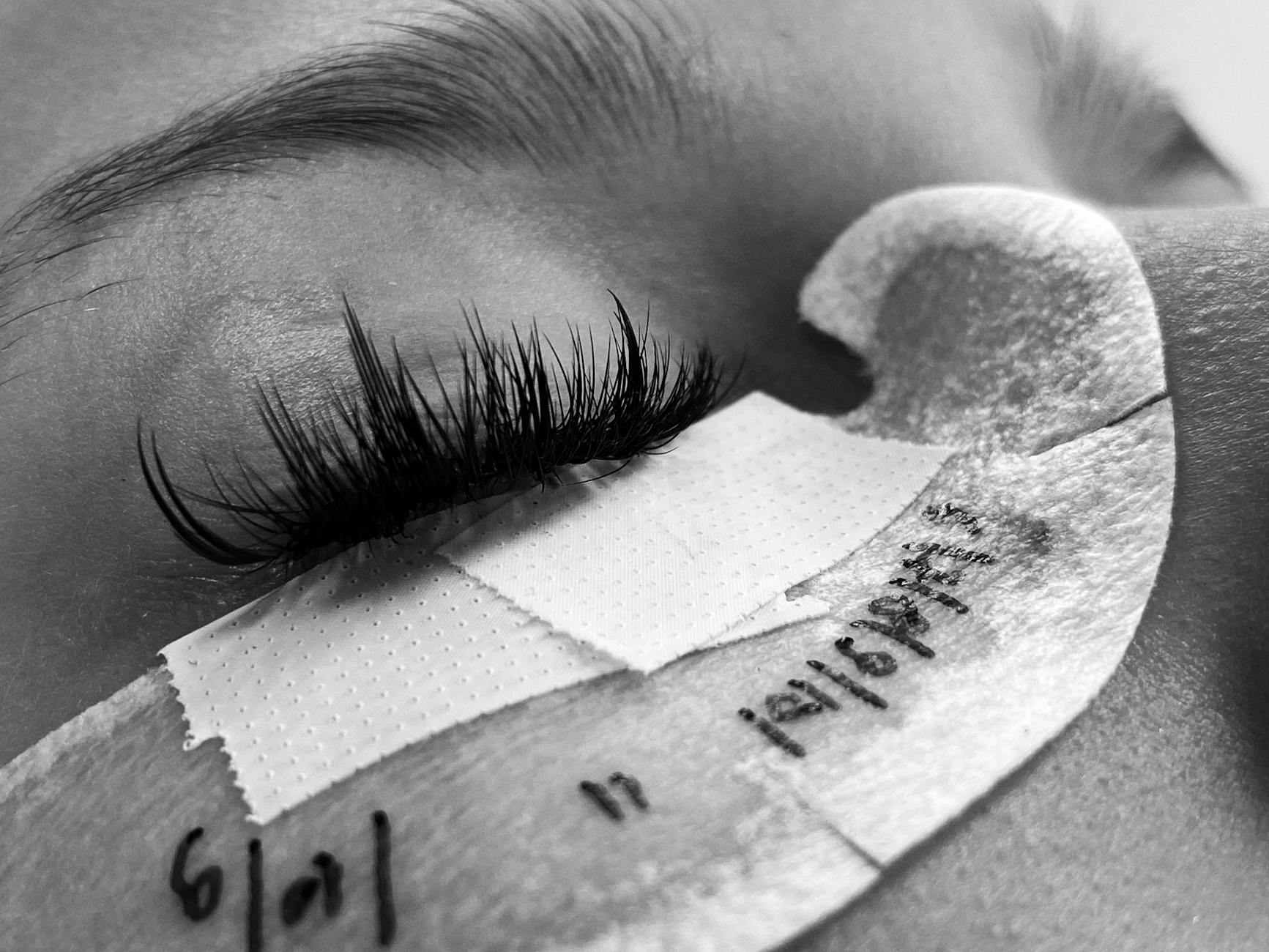 Close-up of beautiful lashes and brows, showcasing precision beauty work